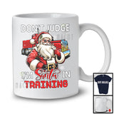 Don't Judge I'm Santa In Training; Sarcastic Christmas Trucker Santa; Snowing X-mas Family T-Shirt