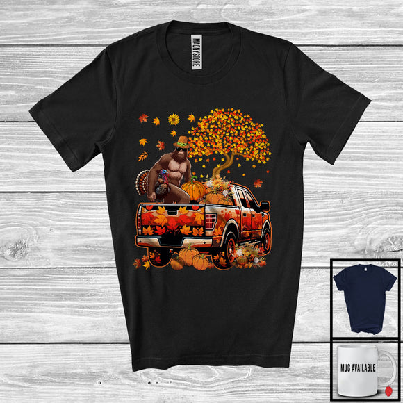 MacnyStore - Bigfoot Taking Turkey Pumpkin On Pickup Truck, Humorous Thanksgiving Fall Leaves Tree, Bigfoot T-Shirt