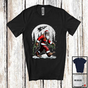 MacnyStore - Bigfoot Wearing Santa Costume X-mas Lights; Humorous Christmas Bigfoot Sasquatch; Snowing T-Shirt