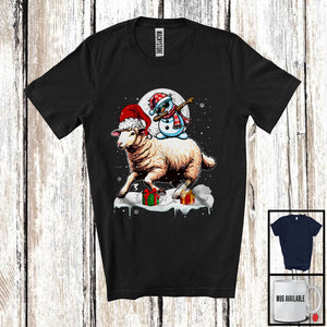 MacnyStore - Dabbing Snowman Riding Sheep; Humorous Christmas Snow Around Farm Animal; X-mas Farmer T-Shirt