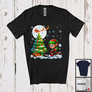 MacnyStore - Elf Playing Hockey Team; Cheerful Christmas Tree Lights Snowing; X-mas Sport Player T-Shirt