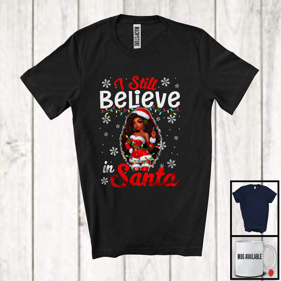 MacnyStore - I Still Believe In Santa; Humorous Christmas Santa Afro Women; Black African American Family T-Shirt