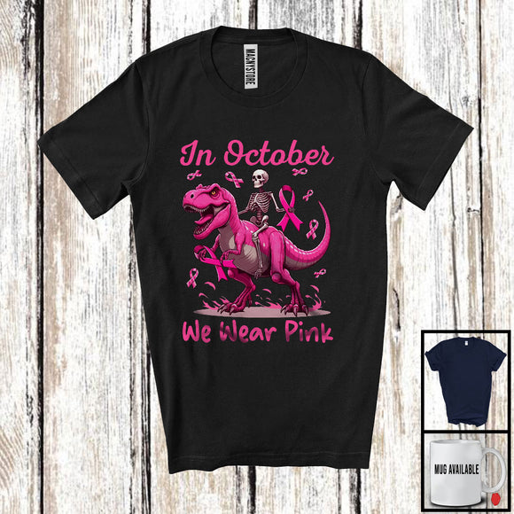 MacnyStore - In October We Wear Pink; Scary Halloween Breast Cancer Awareness Skeleton T-Rex Pink Ribbon T-Shirt