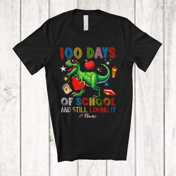 MacnyStore - Personalized 100 Days of School And Still Loving It; Awesome Custom Name T-Rex Holding Heart T-Shirt