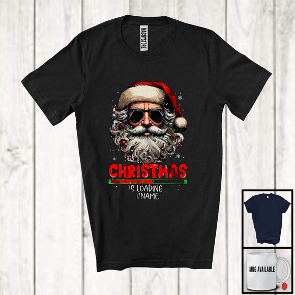 MacnyStore - Personalized Christmas Is Loading; Sarcastic X-mas Santa Face Sunglasses; Custom Name Family T-Shirt