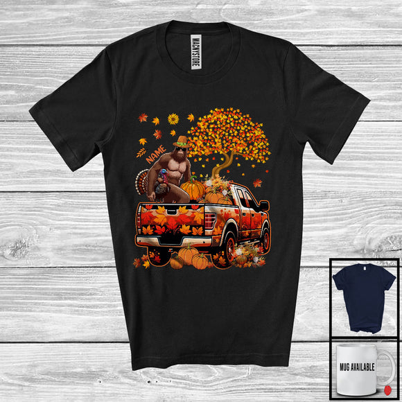 MacnyStore - Personalized Custom Name Bigfoot Taking Turkey Pumpkin On Pickup Truck, Happy Thanksgiving Fall Tree T-Shirt