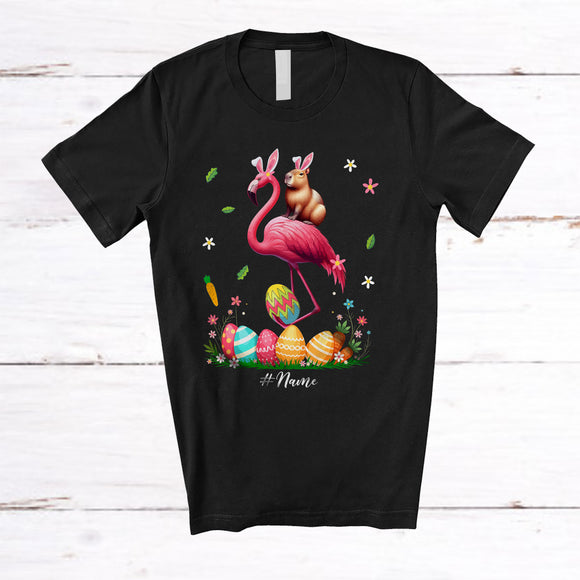 MacnyStore - Personalized Custom Name Capybara Ridding Flamingo; Amazing Easter Eggs Hunting; Family T-Shirt