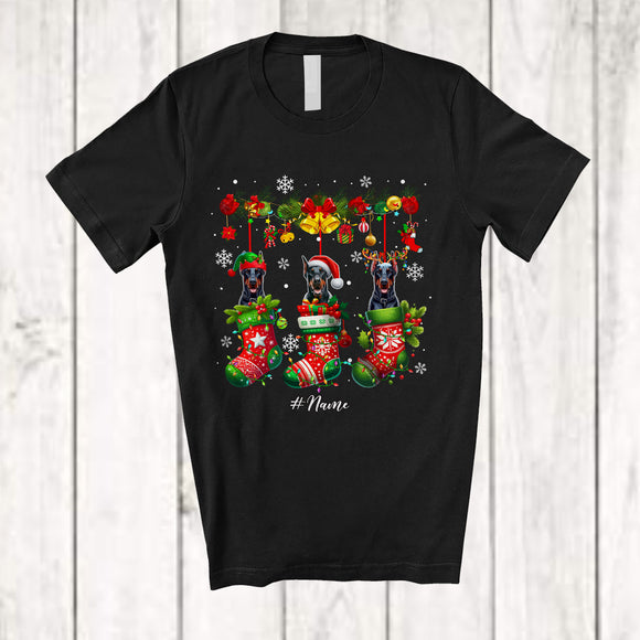 MacnyStore - Personalized Custom Name Dobermanns Dog In Three Christmas Socks; Lovely X-mas Lights Snow T-Shirt