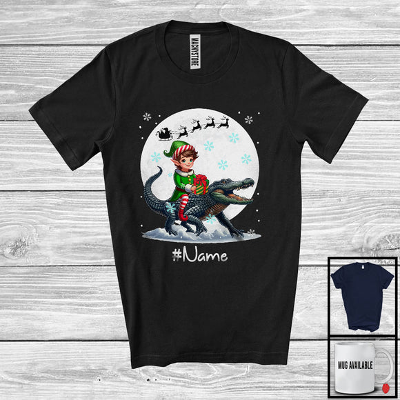 MacnyStore - Personalized Custom Name Elf Riding Alligator, Joyful Christmas Moon Snow Alligator, X-mas Team T-Shirt