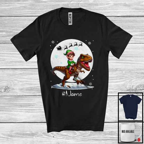 MacnyStore - Personalized Custom Name Elf Riding T-Rex, Joyful Christmas Moon Snow T-Rex, X-mas Team T-Shirt