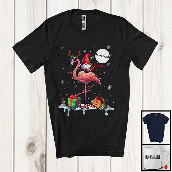 MacnyStore - Personalized Custom Name Gnome Riding Reindeer Flamingo; Adorable Christmas Lights Snow T-Shirt