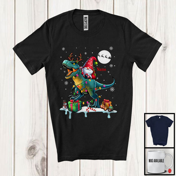 MacnyStore - Personalized Custom Name Gnome Riding Reindeer T-Rex; Adorable Christmas Lights Snow T-Shirt