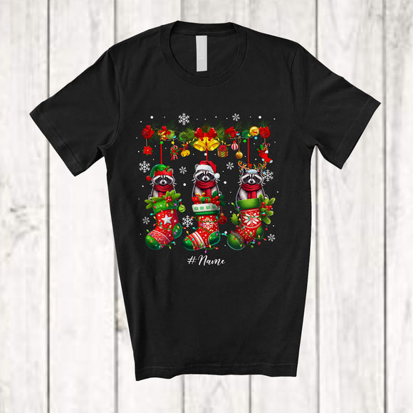 MacnyStore - Personalized Custom Name Raccoon In Three Christmas Socks; Lovely X-mas Lights Snow T-Shirt