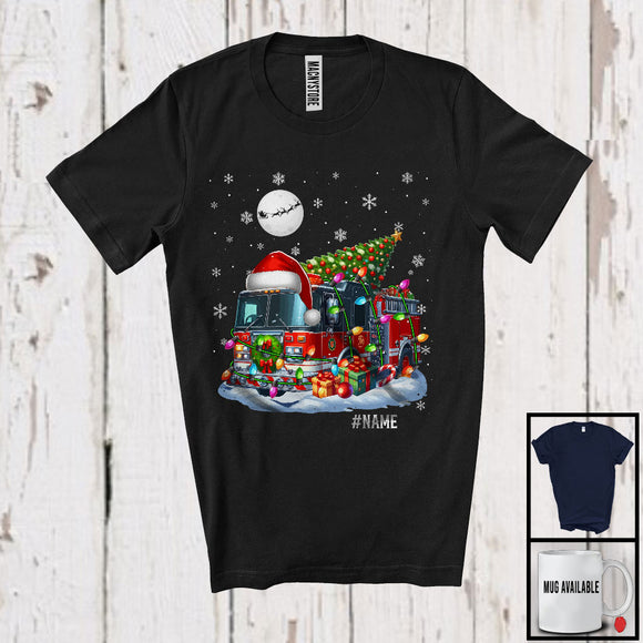 MacnyStore - Personalized Custom Name Santa Firefighter Truck Carrying Christmas Tree; Joyful X-mas Moon Snow T-Shirt