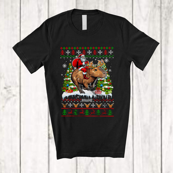 MacnyStore - Personalized Custom Name Santa Riding Capybara; Awesome Christmas Tree Sweater Capybara Animal T-Shirt