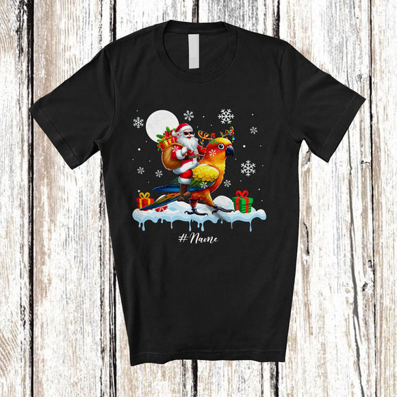 MacnyStore - Personalized Custom Name Santa Riding Sun Conure; Awesome Christmas Snowing Bird; Family T-Shirt