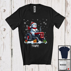 MacnyStore - Personalized Custom Name Snowman Driving Tractor, Adorable Christmas Rider, X-mas Team T-Shirt