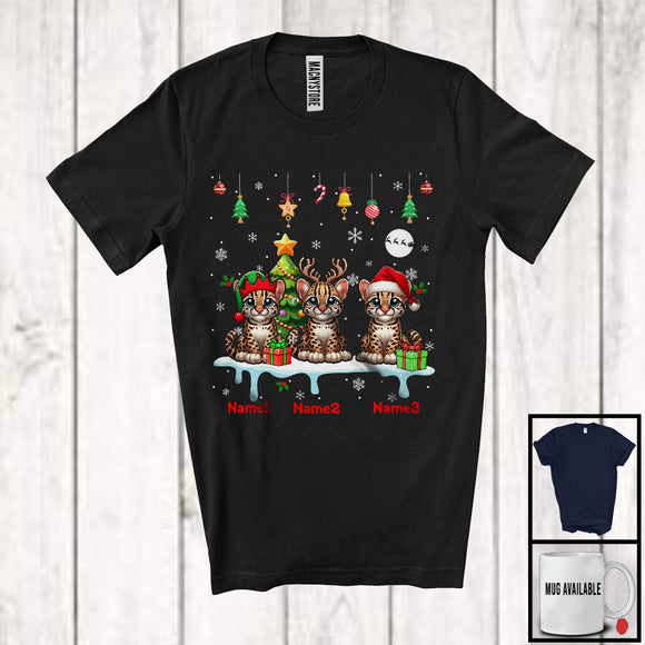 MacnyStore - Personalized Custom Name Three Elf Santa Ocelot Snowing; Joyful Christmas Tree Animal T-Shirt