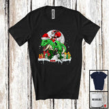 MacnyStore - Personalized Custom Name Santa Riding T-Rex; Lovely Christmas Lights Moon Santa T-Rex Lover T-Shirt