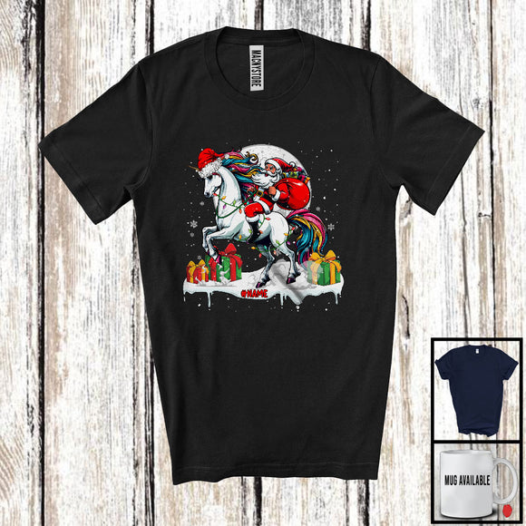 MacnyStore - Personalized Custom Name Santa Riding Unicorn; Lovely Christmas Lights Moon Santa Unicorn Lover T-Shirt