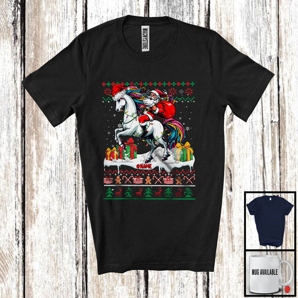 MacnyStore - Personalized Custom Name Santa Riding Unicorn; Lovely Christmas Lights Sweater Santa Unicorn Lover T-Shirt