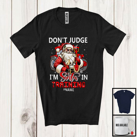 MacnyStore - Personalized Don't Judge Santa In Training; Humorous Christmas Custom Name Farmer Santa T-Shirt