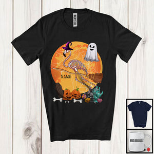 MacnyStore - Personalized Flamingo Skeleton Witch On Broomstick, Scary Halloween Moon, Custom Name Boo Ghost T-Shirt