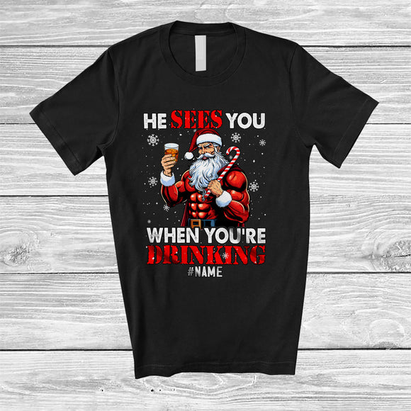 MacnyStore - Personalized He Sees When You're Drinking; Merry Christmas Santa Bourbon; Snowing Drunker T-Shirt