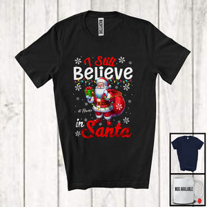 MacnyStore - Personalized I Still Believe In Santa; Lovely Christmas Lights Custom Name Santa; Family T-Shirt