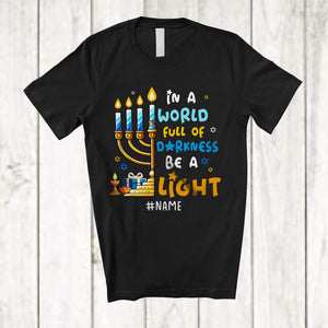 MacnyStore - Personalized In A World Full Of Darkness Be A Light; Joyful Hanukkah Custom Name Menorah Light T-Shirt