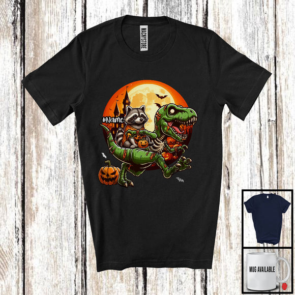 MacnyStore - Personalized Raccoon Riding T-Rex Zombie; Horror Halloween Custom Name Dinosaur Lover T-Shirt