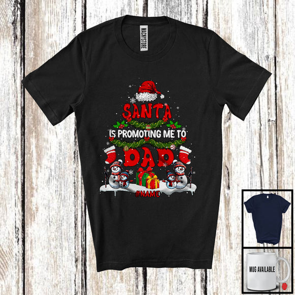 MacnyStore - Personalized Santa Is Promoting Me To Dad; Merry Christmas Santa Tree; Custom Name Family T-Shirt