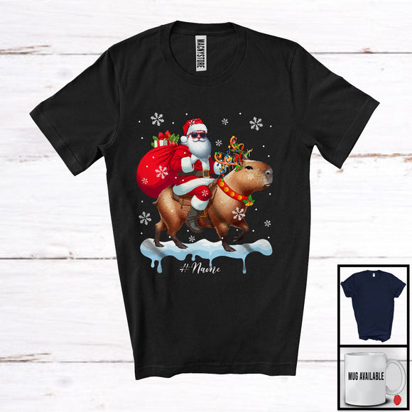 MacnyStore - Personalized Santa Riding Capybara; Amazing Christmas Snow Custom Name Capybara; Rodent T-Shirt