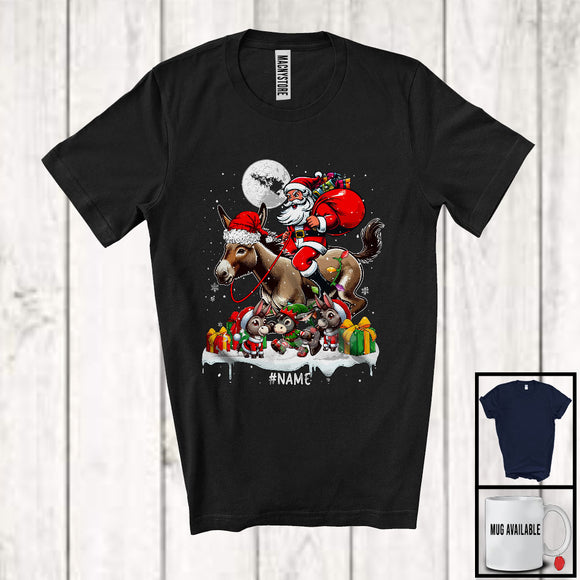 MacnyStore - Personalized Santa Riding Donkey With Baby Donkeys; Lovely Christmas Lights; Custom Name Farmer T-Shirt