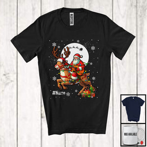 MacnyStore - Personalized Santa With Guitar Riding Reindeer; Joyful Christmas Custom Name Musical Instruments T-Shirt