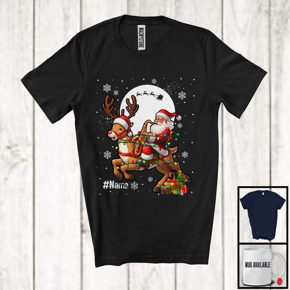 MacnyStore - Personalized Santa With Saxophone Riding Reindeer; Joyful Christmas Custom Name Musical Instruments T-Shirt