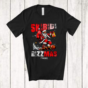 MacnyStore - Personalized Skibidi Rizzmas; Joyful Christmas Custom Name Santa Playing Snowboard; Family T-Shirt