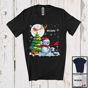 MacnyStore - Personalized Snowman Playing Footgolf Team; Joyful Christmas Custom Name Sport Player T-Shirt