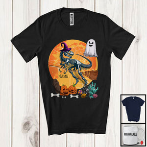 MacnyStore - Personalized T-Rex Skeleton Witch On Broomstick, Scary Halloween Moon, Custom Name Boo Ghost T-Shirt