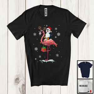 MacnyStore - Santa Penguin Riding Reindeer Flamingo; Adorable Christmas Lights Animal Lover; Snowing T-Shirt