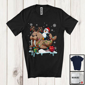 MacnyStore - Santa Penguin Riding Reindeer Walrus; Adorable Christmas Lights Animal Lover; Snowing T-Shirt