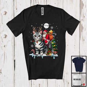 MacnyStore - Santa Riding American Shorthair Cat Reindeer; Humorous Christmas Tree Lights Santa; Family Group T-Shirt