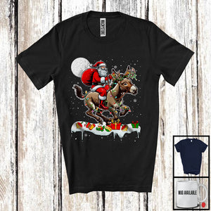 MacnyStore - Santa Riding Donkey Reindeer; Amusing Christmas Lights Santa Donkey Animal; Snowing T-Shirt