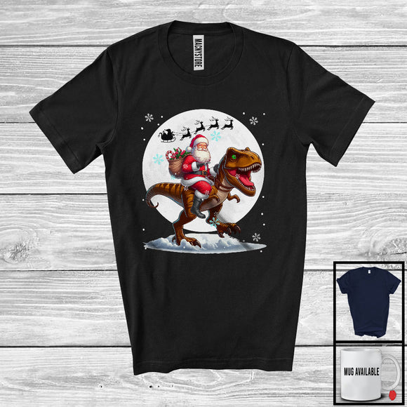 MacnyStore - Santa Riding T-Rex, Merry Christmas Moon Snow T-Rex Dinosaur Lover, Matching X-mas Group T-Shirt