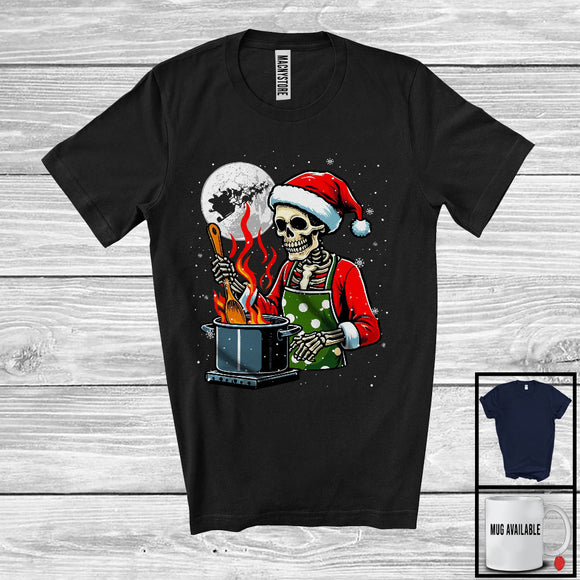 MacnyStore - Skeleton Cooking; Humorous Christmas Santa Skeleton Cooking Chef; X-mas Moon Snowing T-Shirt