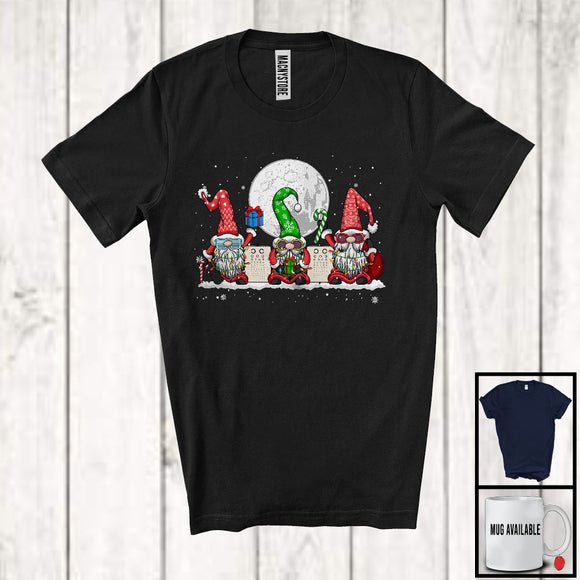 MacnyStore - Three Gnomes With Optical Technician Tools; Lovely Christmas Gnomies Snowing; Moon Family T-Shirt