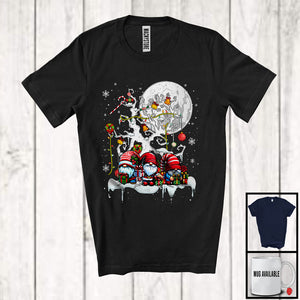 MacnyStore - Three Gnomes With X-mas Tree; Lovely Christmas Moon Gnomies Squad; Snowing Around T-Shirt