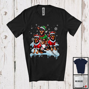 MacnyStore - Three Santa Elf Australian Kelpies On Snow; Adorable Christmas Snowing Dog; Family X-mas Group T-Shirt