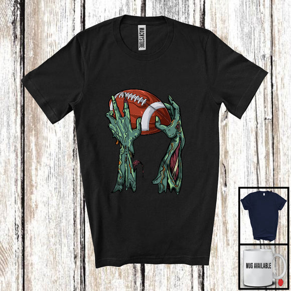 MacnyStore - Zombie Hand Holding Football Ball; Amazing Halloween Football Player; Sport Team T-Shirt